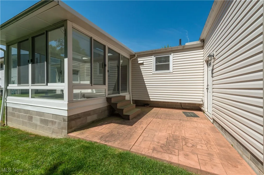 View of patio / terrace featuring a sunroom