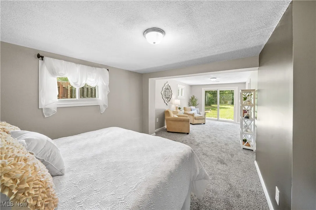 view of master suite with access to the private back yard patio.
