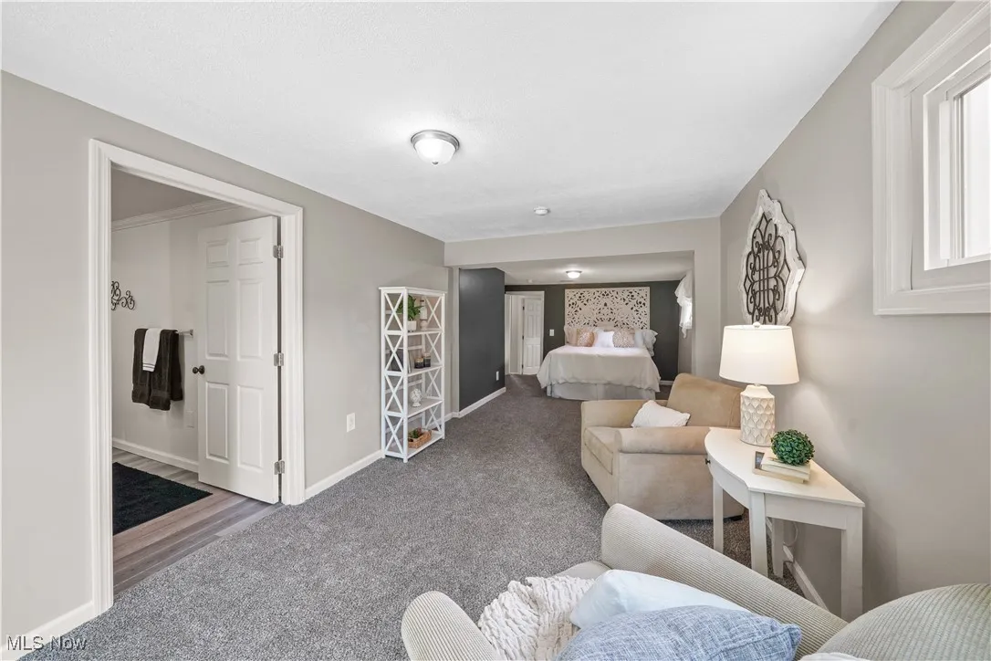 master suite offers sleeping and living space as well as updated full bathroom.