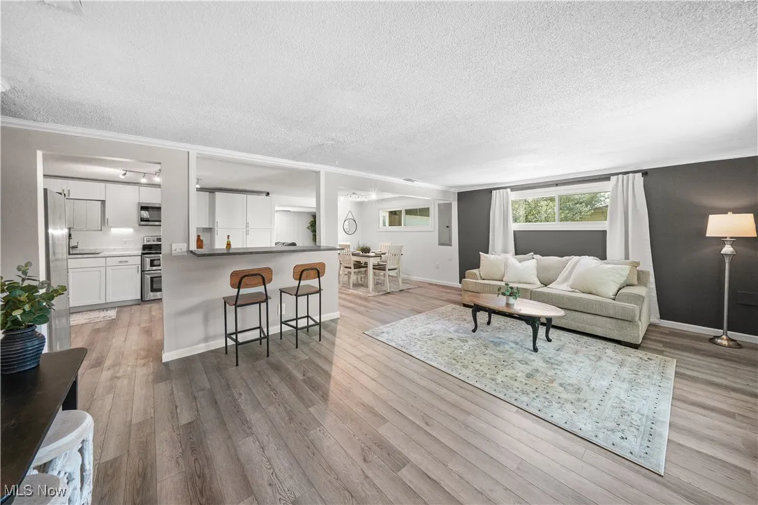 The great room offers spacious living and bar access to the kitchen.