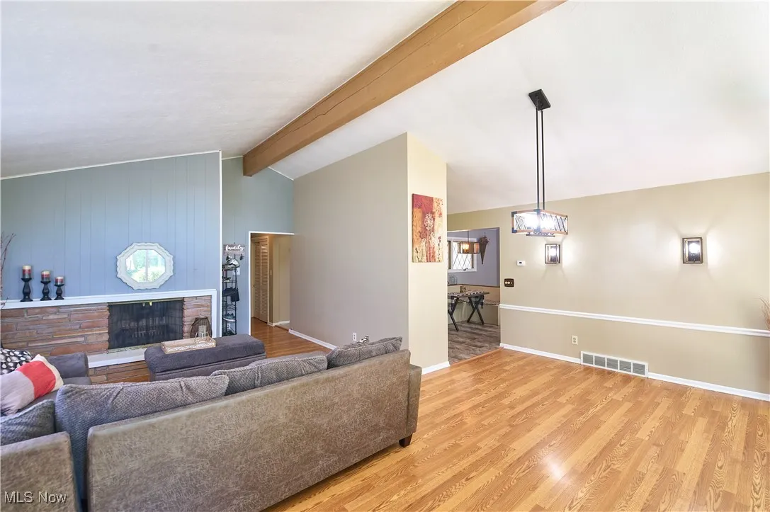 Living area featuring light wood-style flooring and baseboards