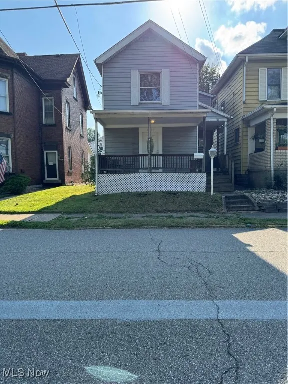 View of front of property featuring a porch