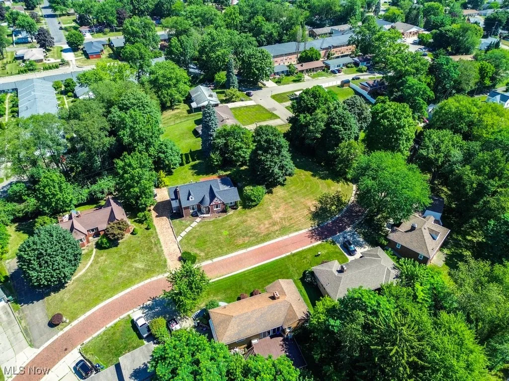 Aerial overview of property's location with nearby suburban area