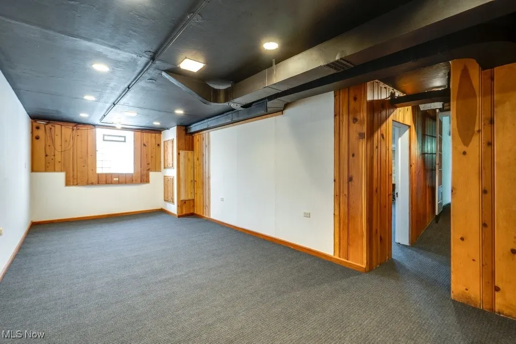 Below grade area with carpet floors and recessed lighting