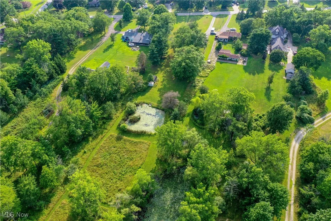 Large backyard with pond and shed
