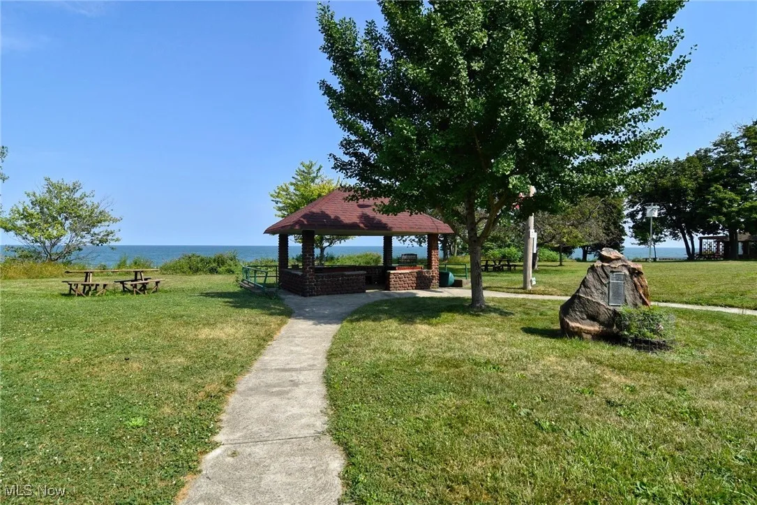 View of home's community with a gazebo and a yard