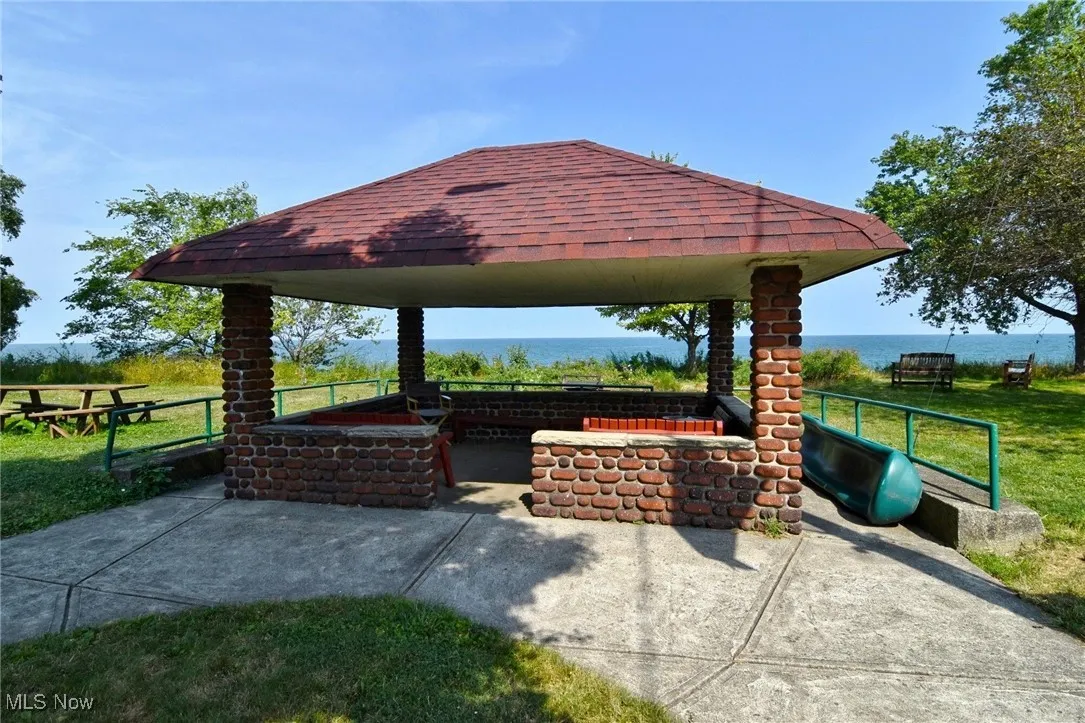 View of patio featuring a gazebo and a water view