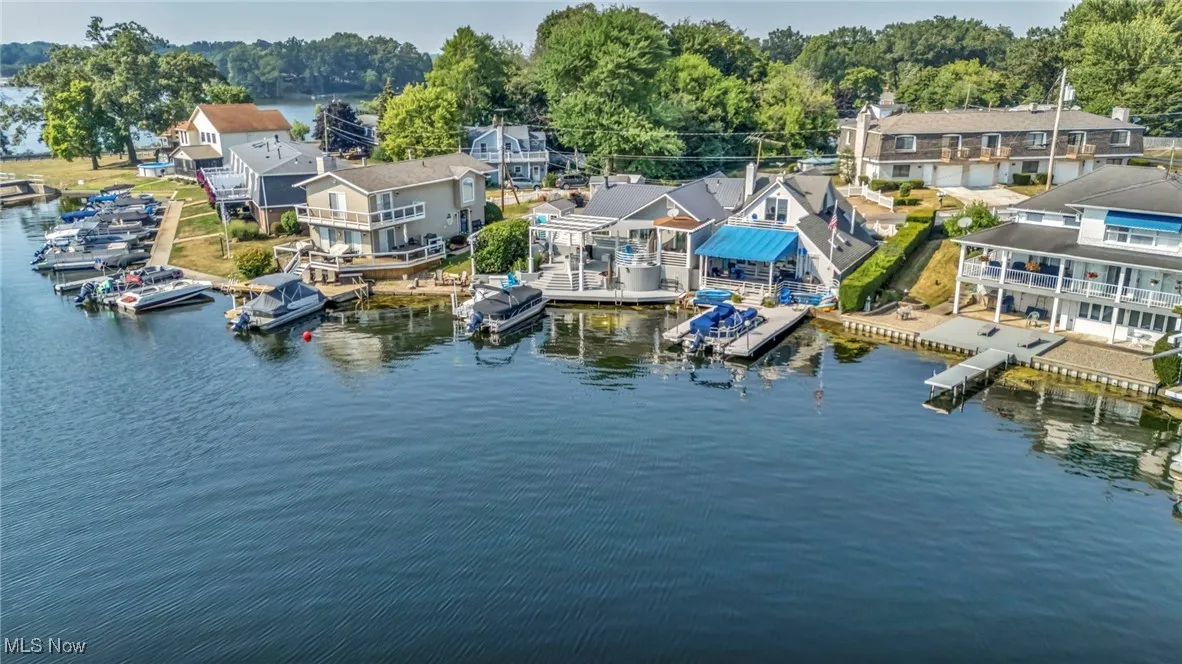 Aerial perspective of suburban area featuring a large body of water
