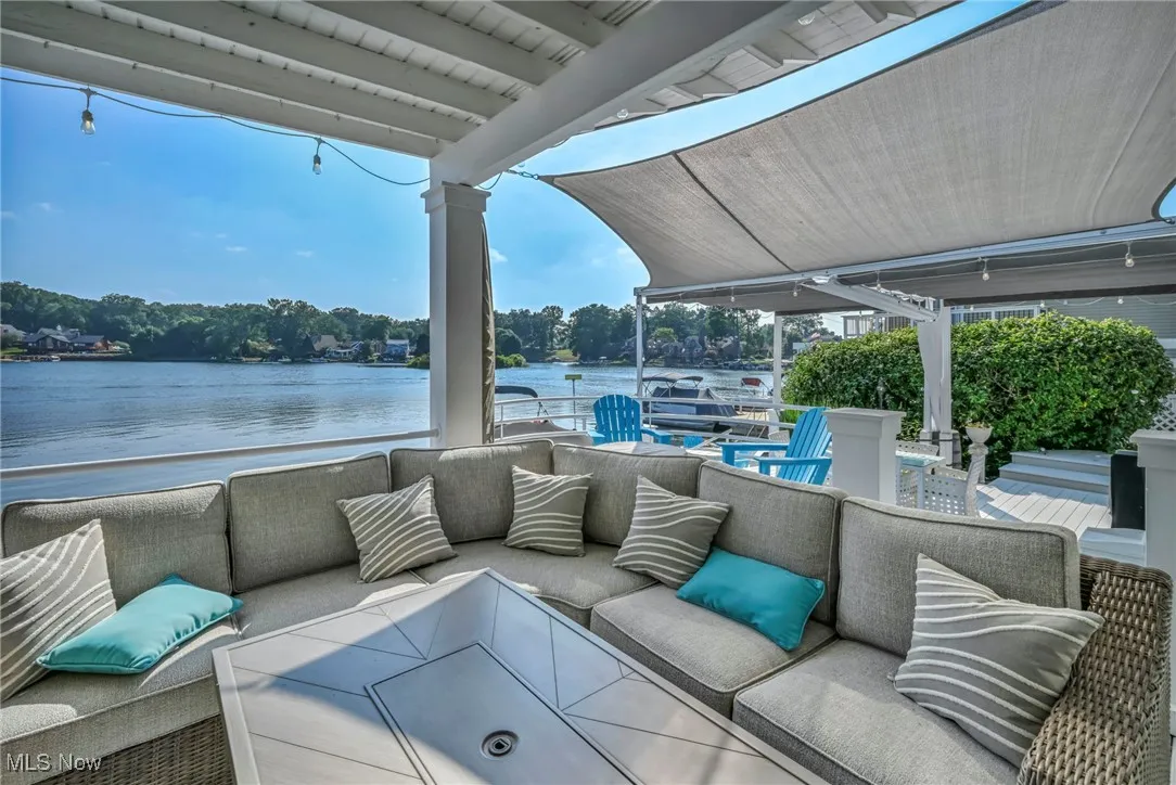 View of patio / terrace featuring outdoor lounge area and a water view