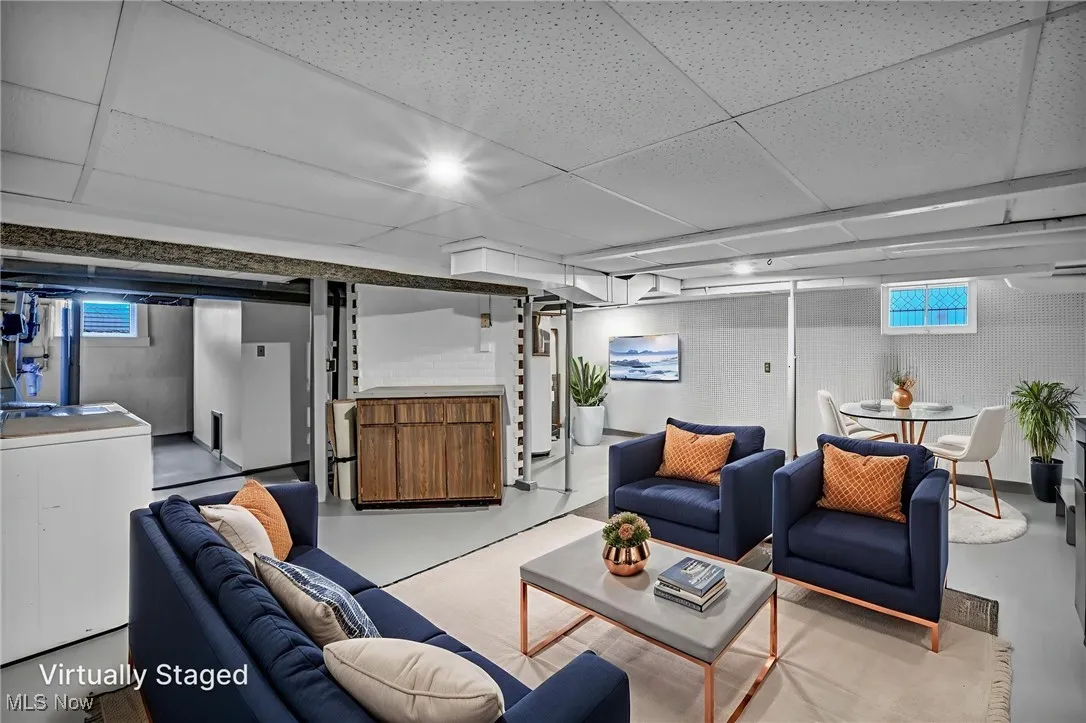 Basement featuring virtually staged rec room