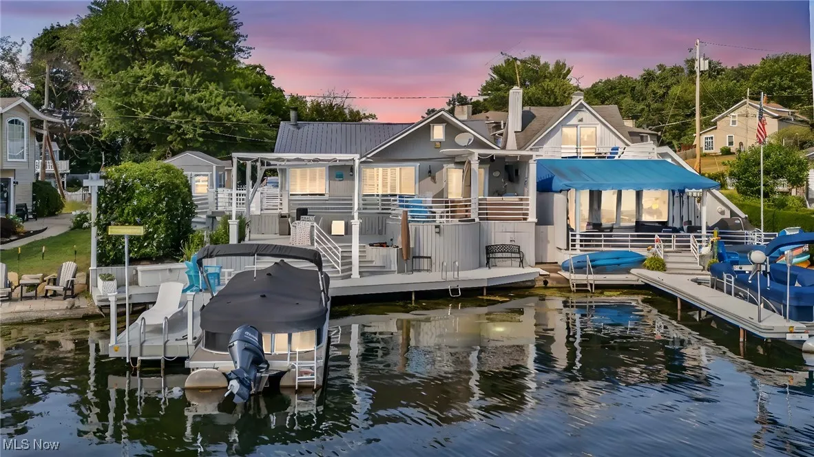 Dock area with a water view and boat lift