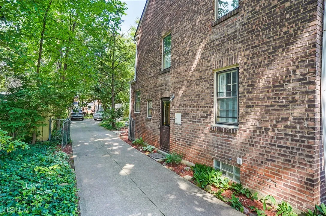 View of side of home with brick siding
