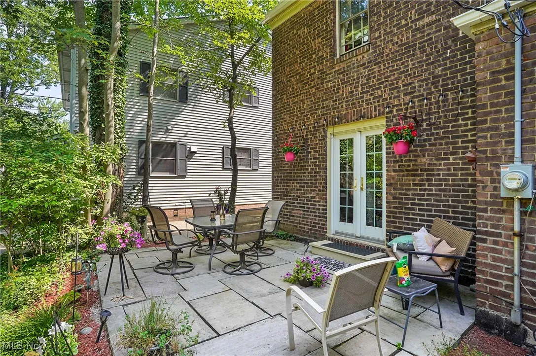 View of patio featuring french doors and outdoor dining space