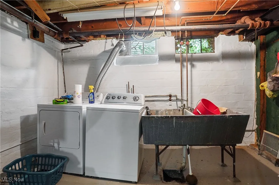 Laundry room featuring washer and clothes dryer