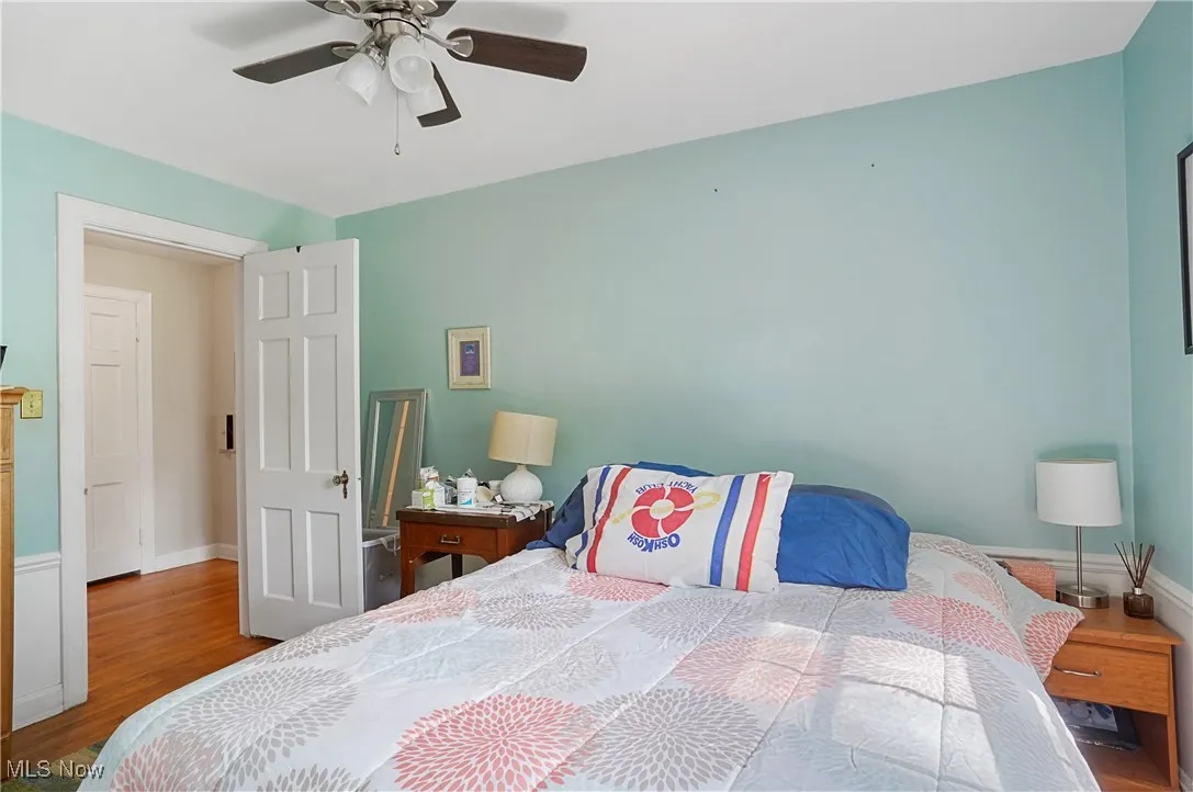 Bedroom featuring wood finished floors and ceiling fan