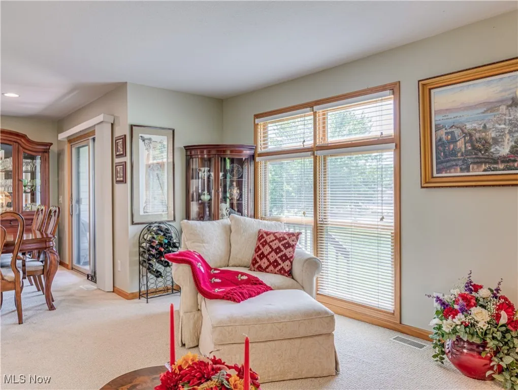 Living room with floor to ceiling window for loads of natural light opens to the Dining room and Kitchen