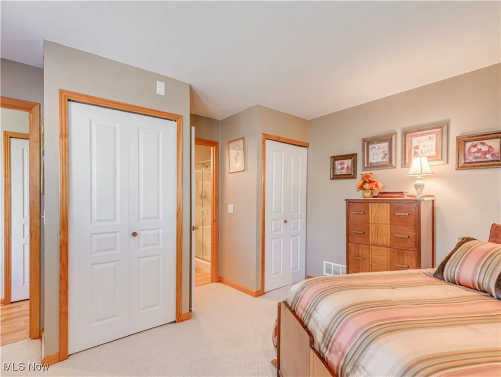 First floor bedroom with direct access to the full bathroom with walk-in shower.  There are two large closets in the bedroom
