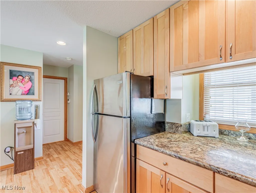 Kitchen is just inside the main entry and foyer with easy access to the Dining Room and Living Room and a full first floor bath and bedroom