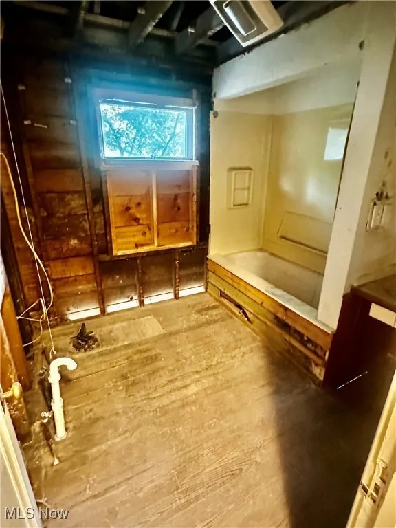Full bathroom featuring wood finished floors