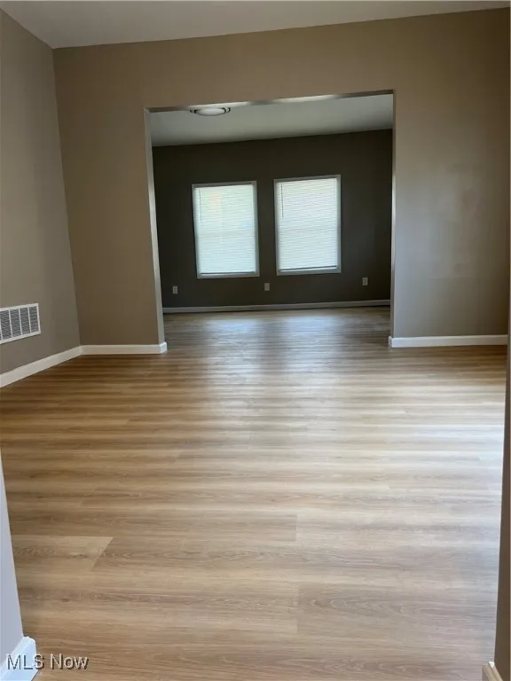 Unfurnished room with light wood finished floors