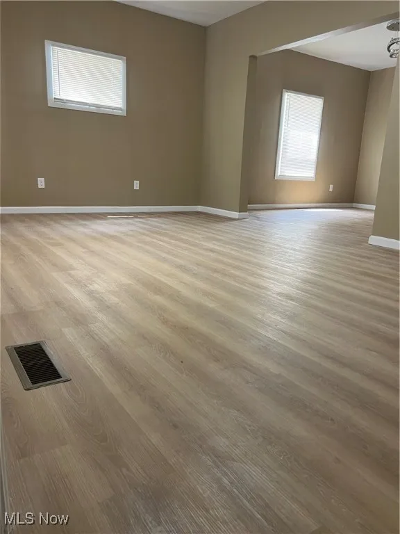 Unfurnished room with light wood-style flooring