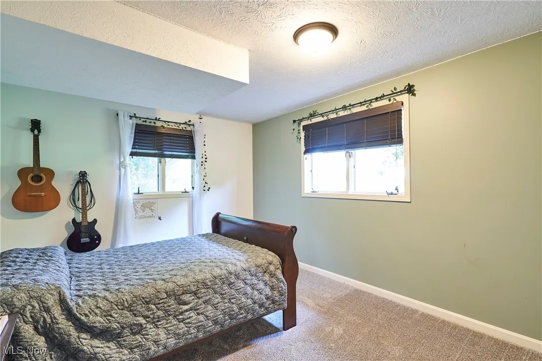 Carpeted bedroom bright and airy