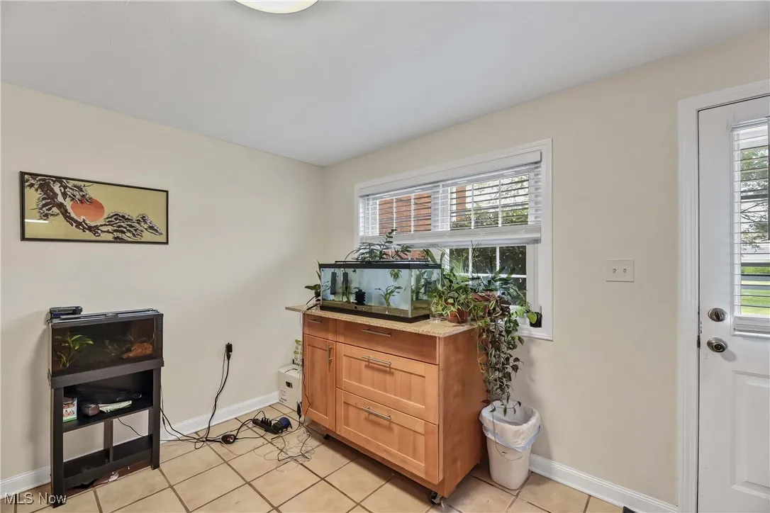 Foyer with light tile patterned floors