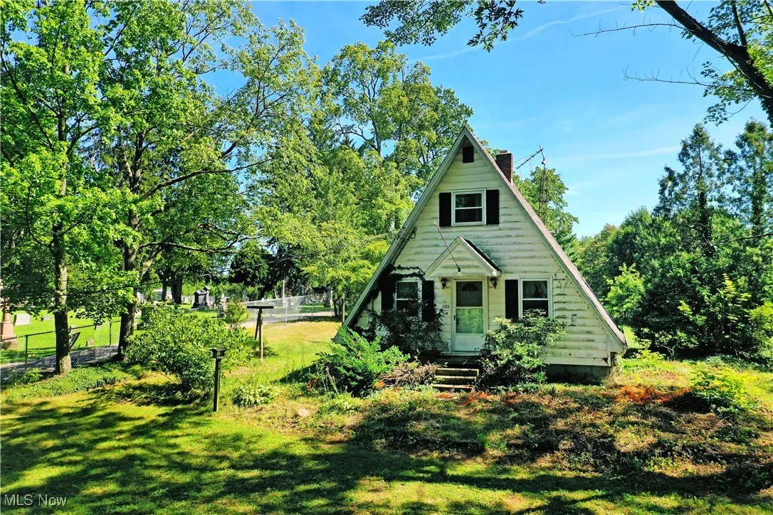 View of front of home with a chimney