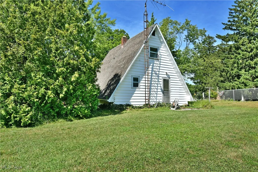 View of home's exterior with a chimney