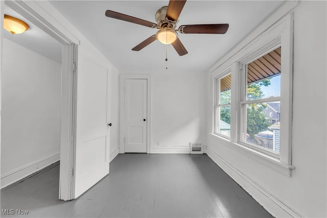 Spare room with ceiling fan and wood finished floors