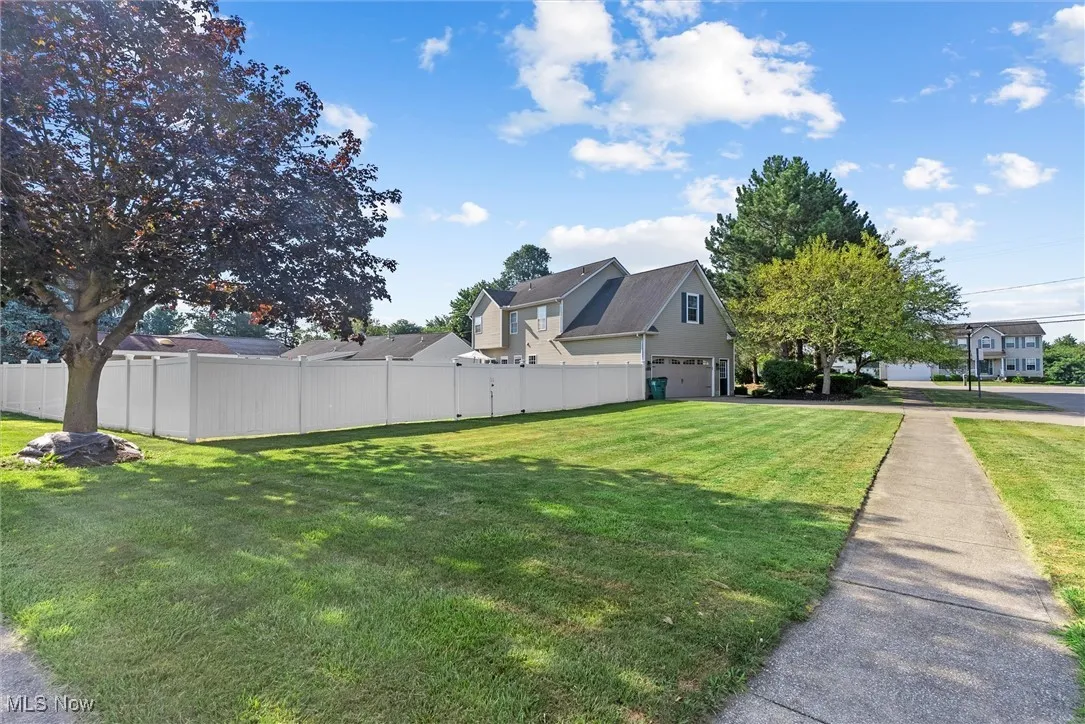 View of yard featuring an attached garage