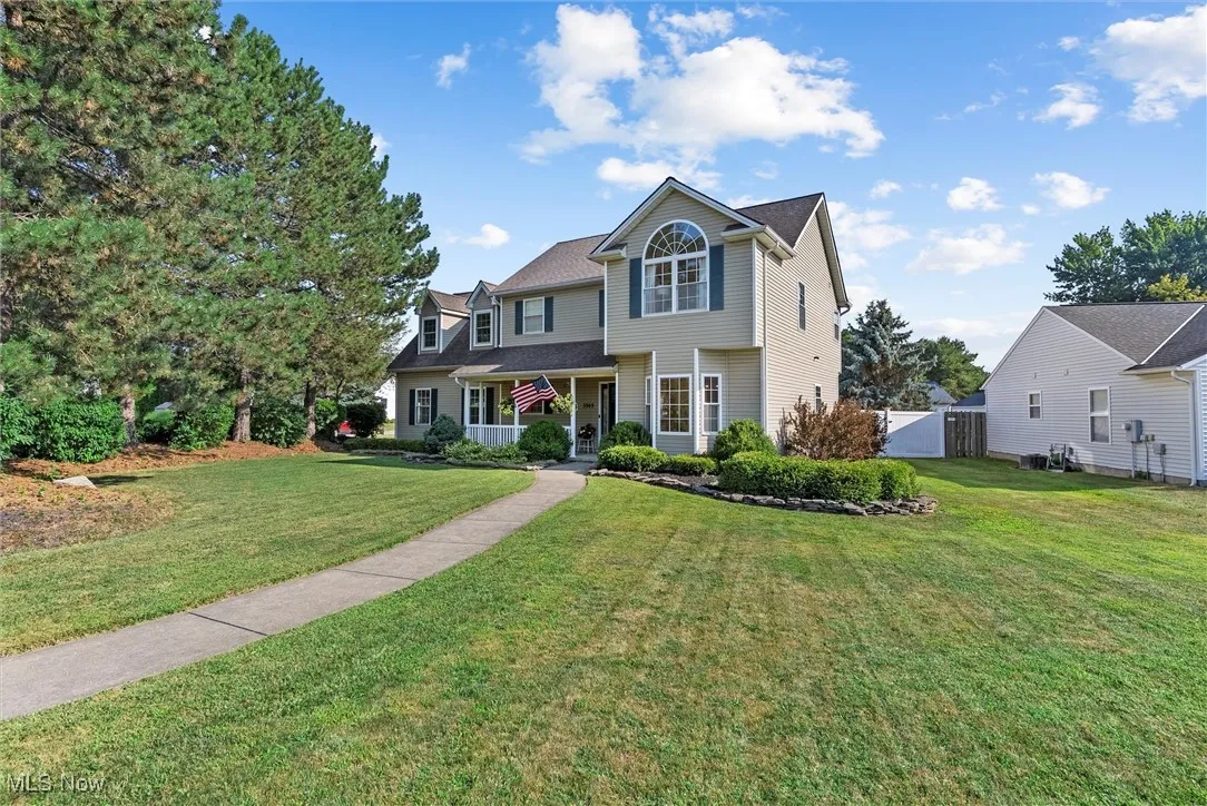 Traditional-style home with covered porch