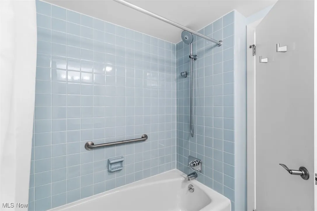 Full bath featuring shower / tub combo