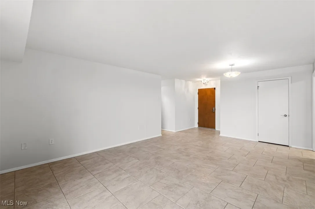 Empty room featuring baseboards