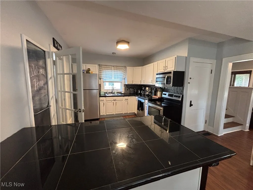 View of kitchen area with appliances