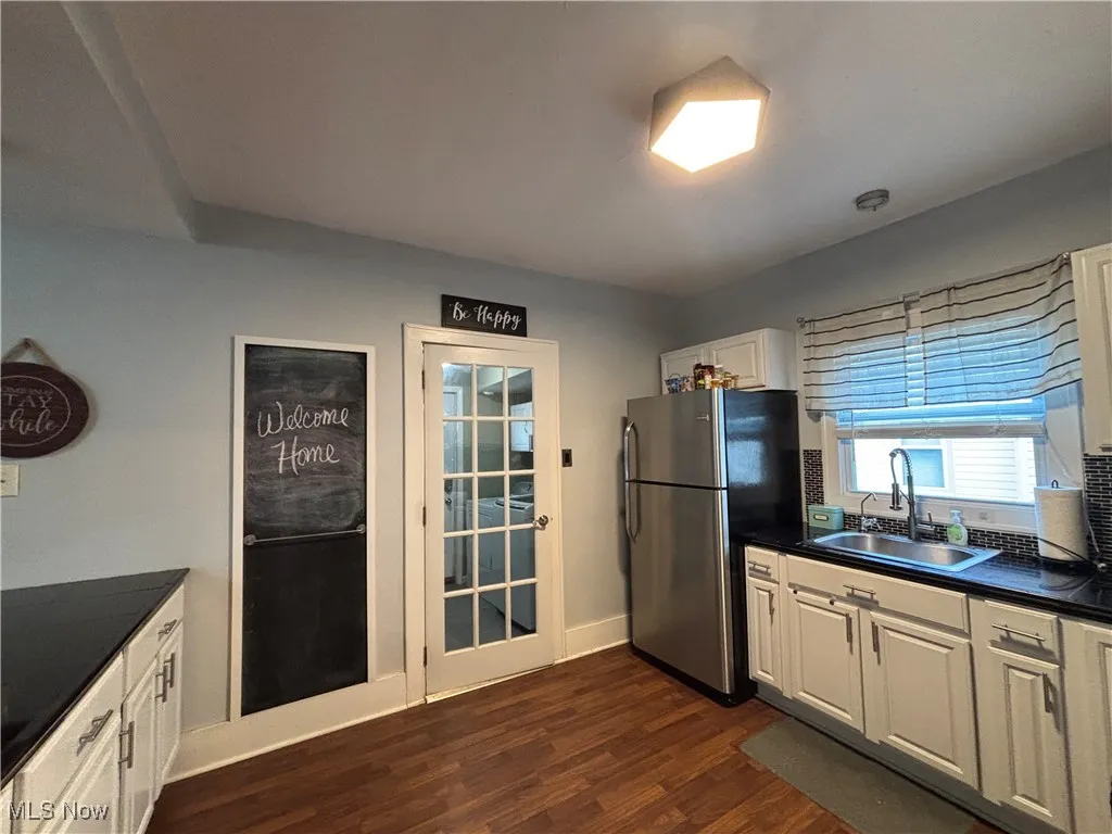 Kitchen area view with entry to laundry room