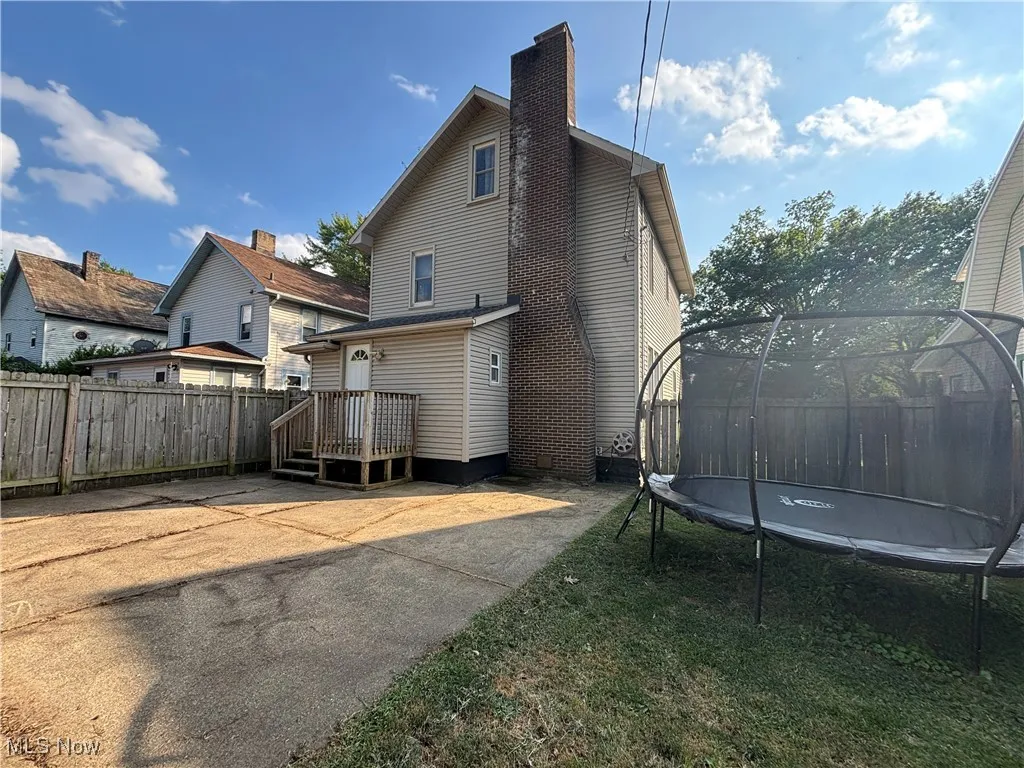 View of back of home with patio and yard area