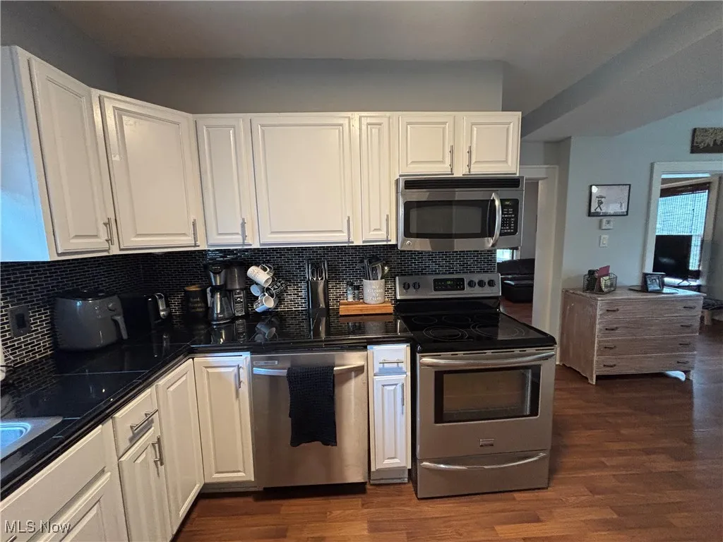 Kitchen area view with backsplash and countertops