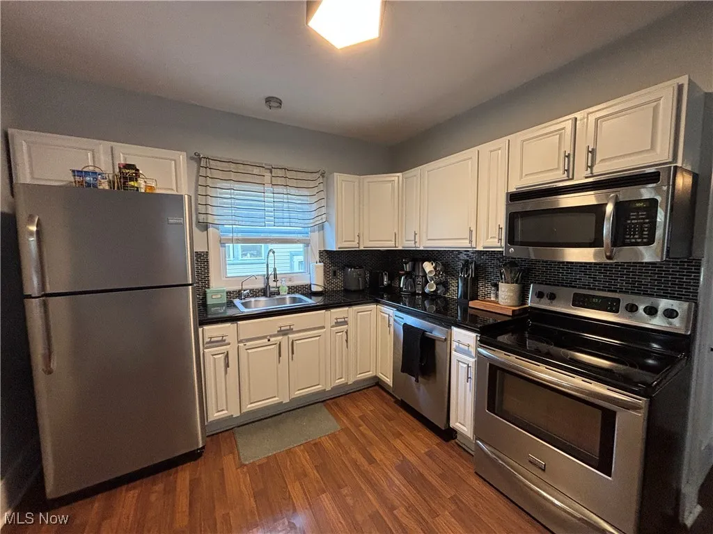 View of kitchen area with appliances