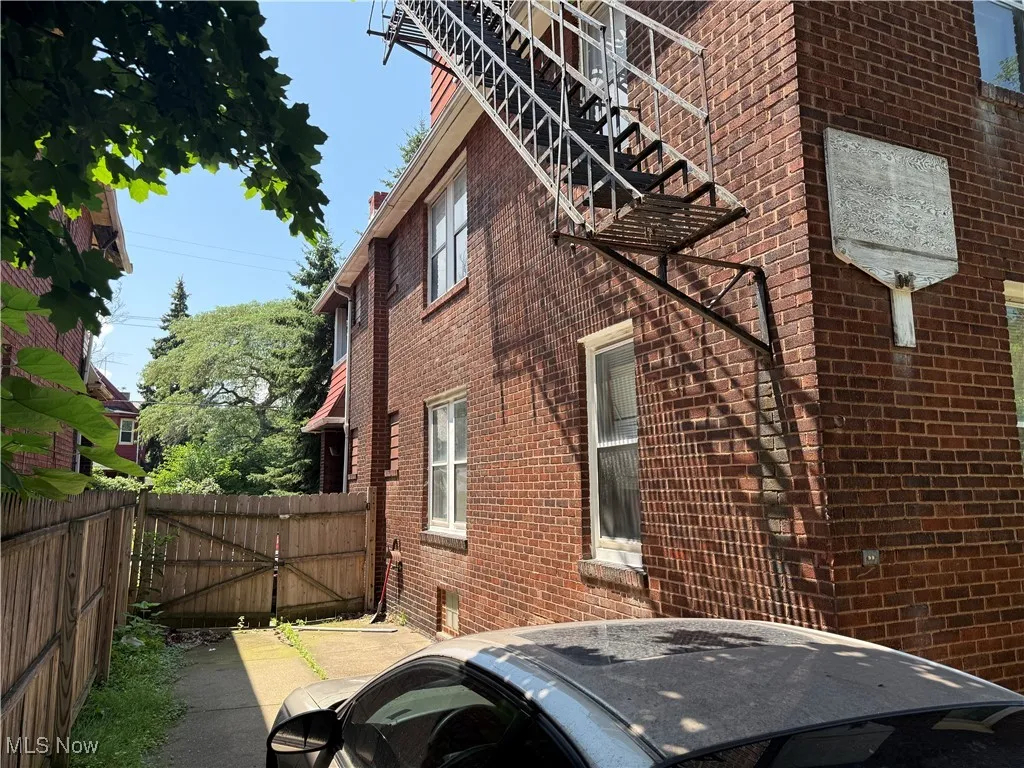 View of side of home with brick siding