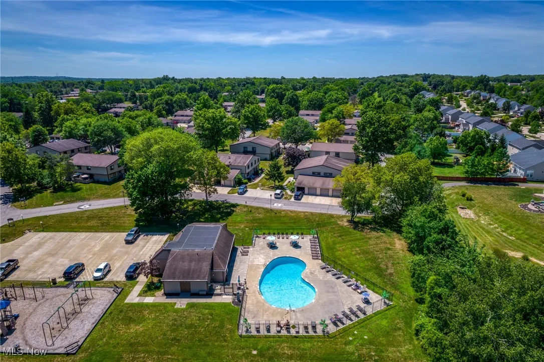 Aerial perspective of suburban area featuring a pool area