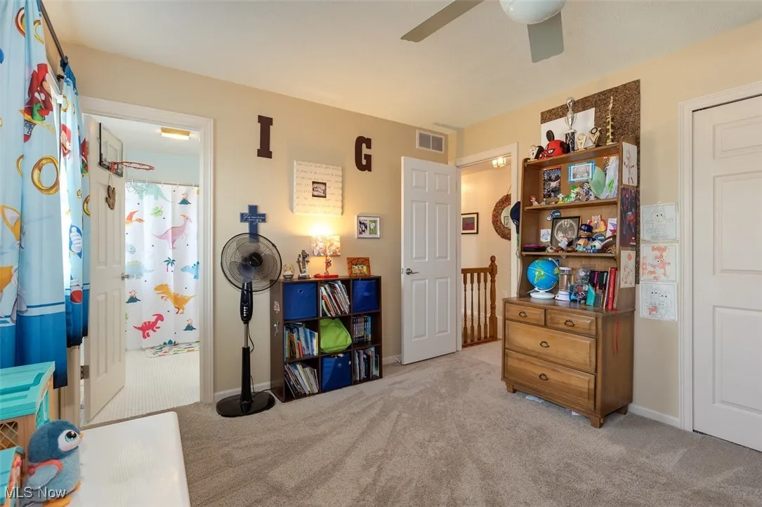 Bedroom featuring carpet and a ceiling fan