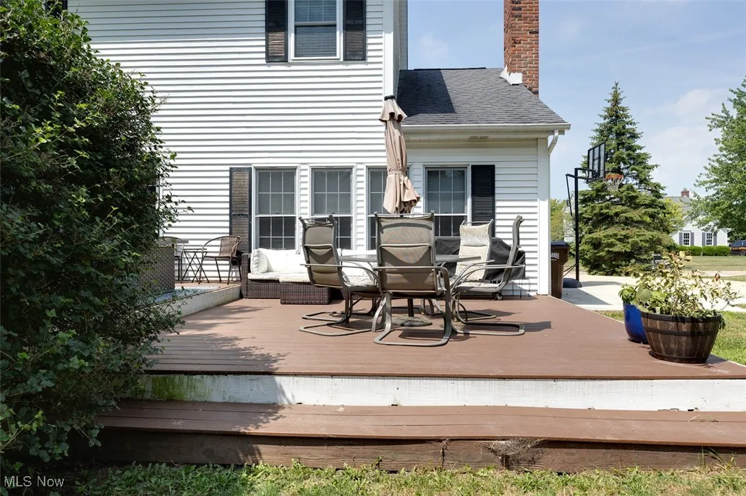 Wooden deck featuring outdoor dining space