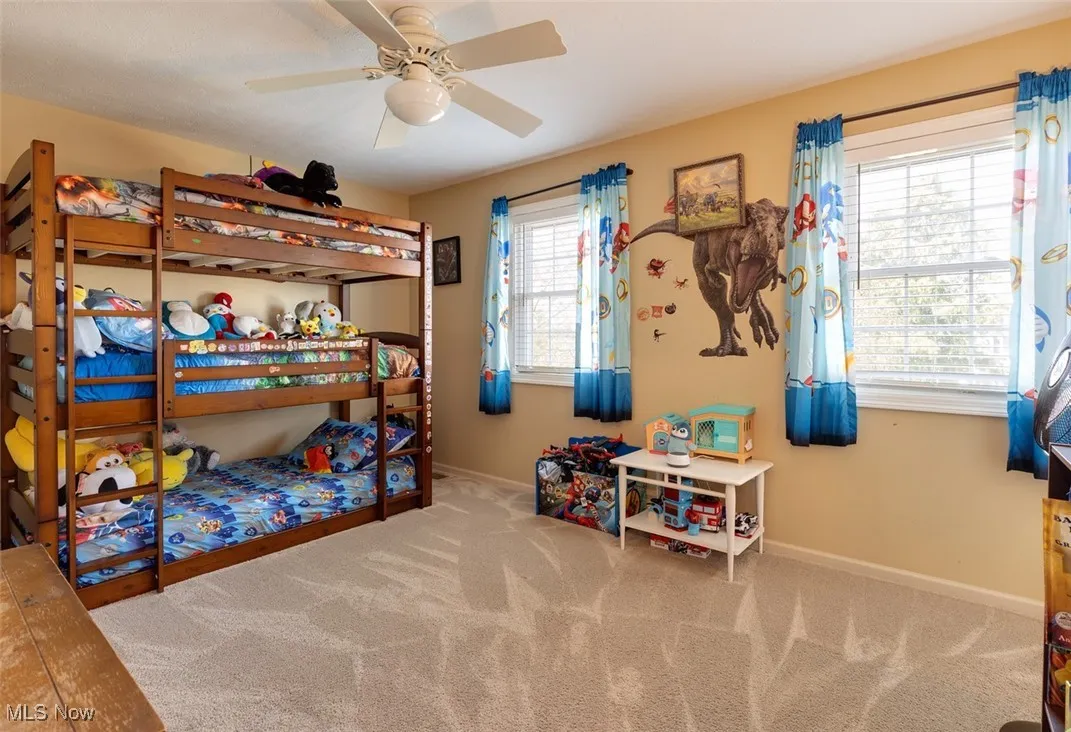 Bedroom with carpet and ceiling fan