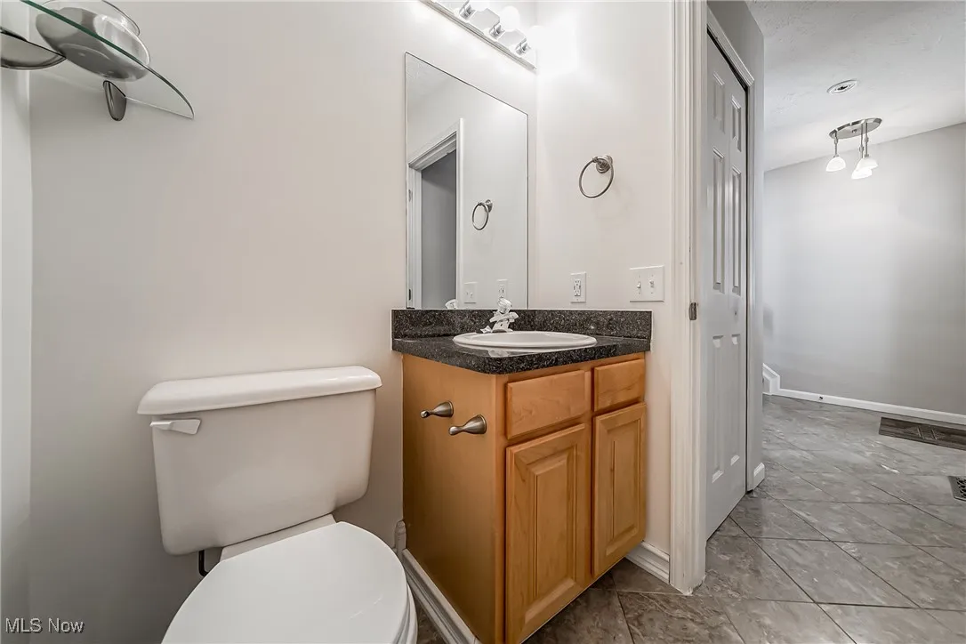 Bathroom with vanity and tile patterned flooring