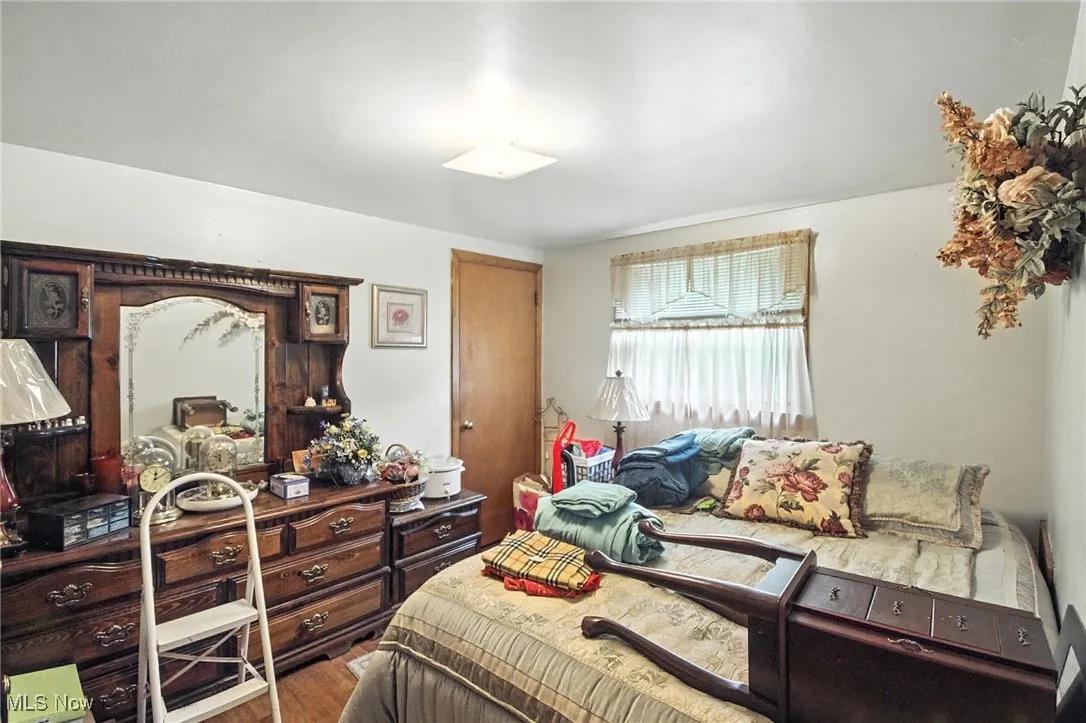 Bedroom with wood finished floors