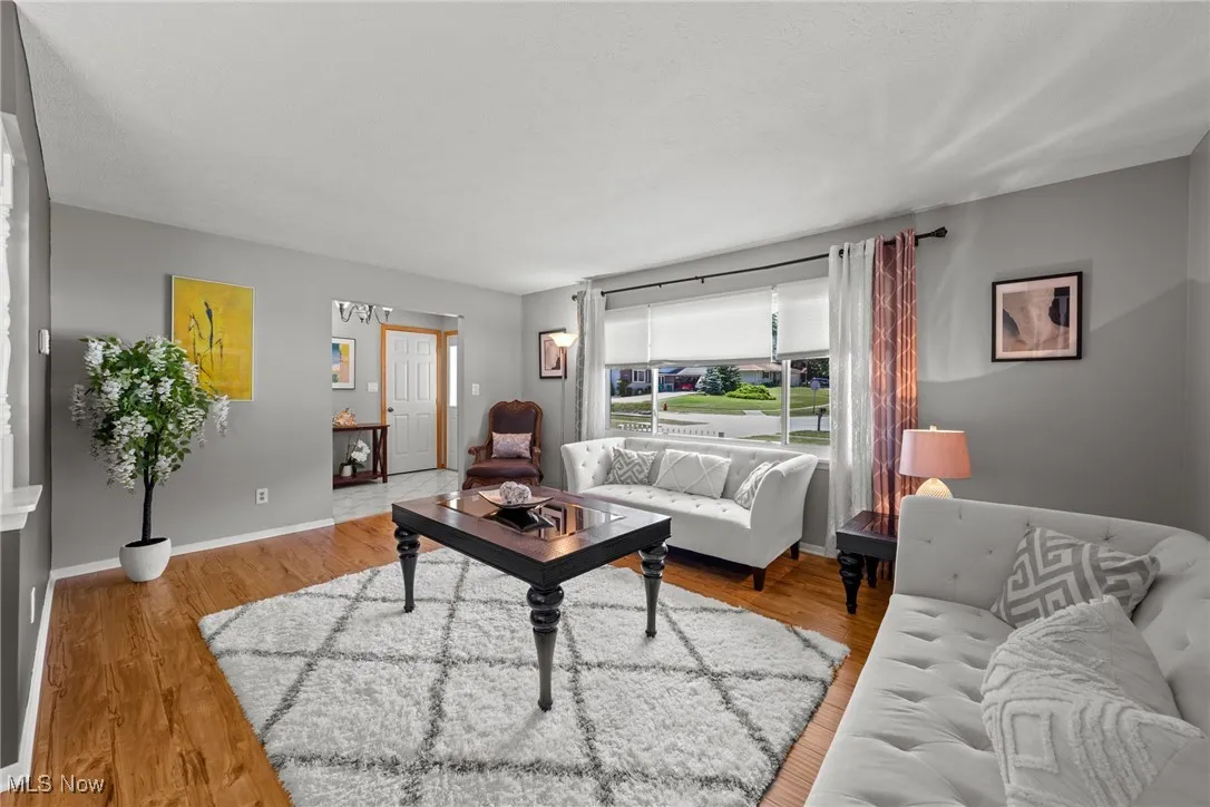 Living room with wood finished floors and baseboards