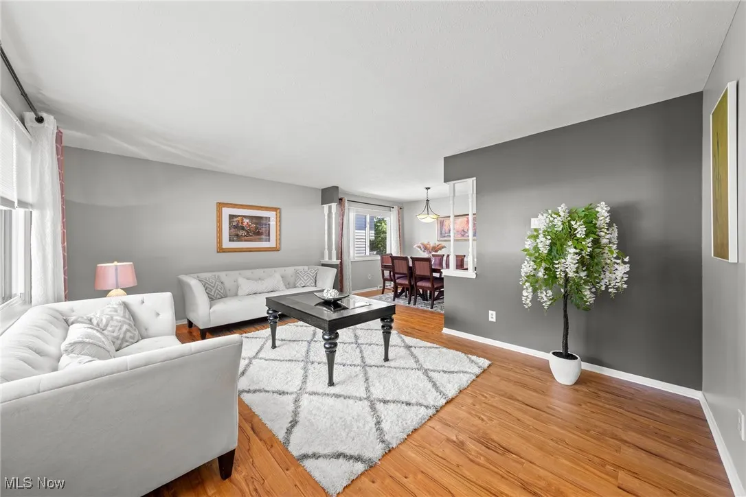 Living room featuring wood finished floors and baseboards