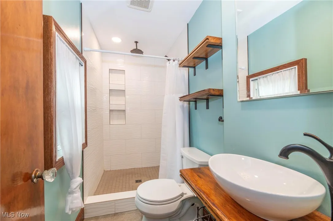 First floor full Bathroom with a stall shower and recessed lighting