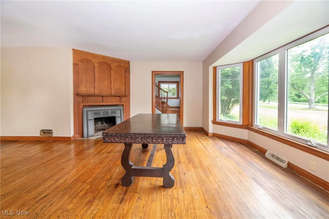 Living room featuring a fireplace and hardwood flooring